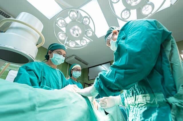 Surgeons doing surgery on patient with fatty liver