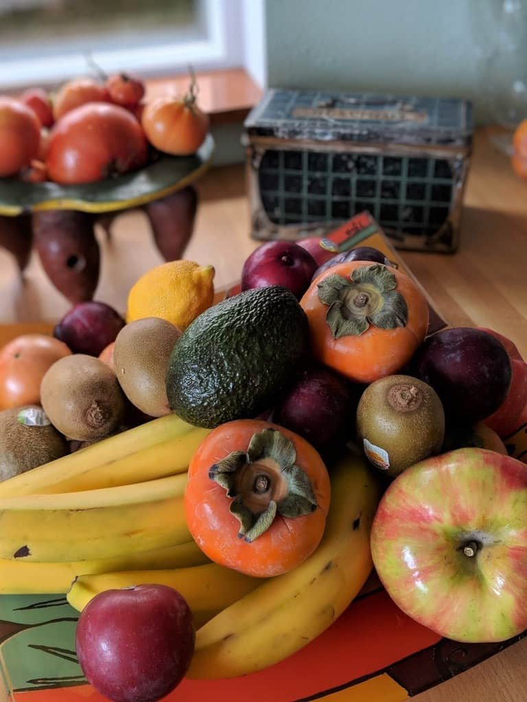Variety of fruits on a kitchen counter top to promote healthy eating