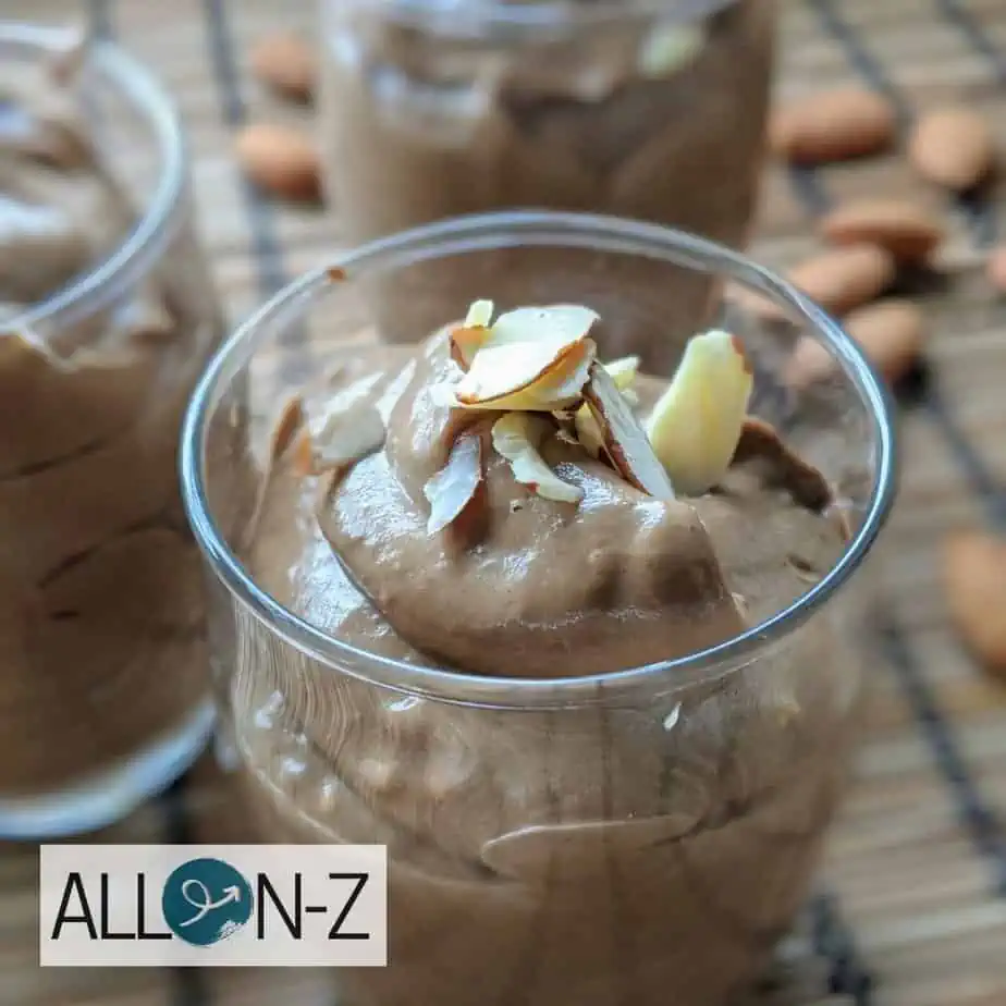 Jar with healthy chocolate pudding and almond slivers
